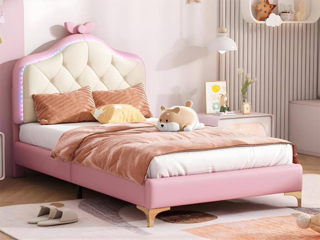 Upholstered children's bed with colorful LED lighting and bow on the headboard - in faux leather - 90x200cm - with slatted base by Meublita - Pink